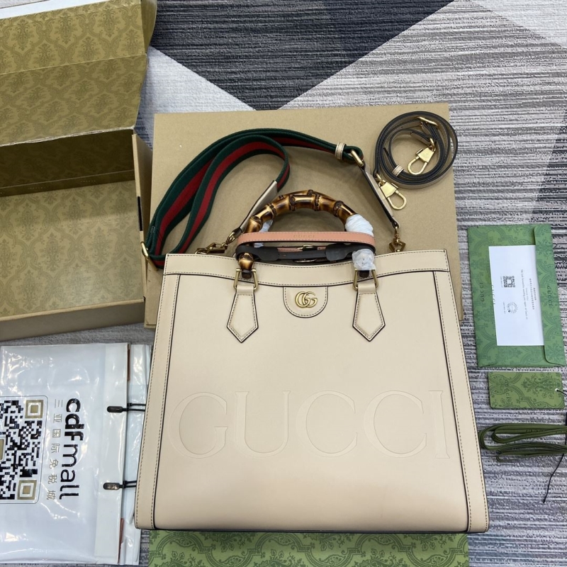 G*u*i top handle bags